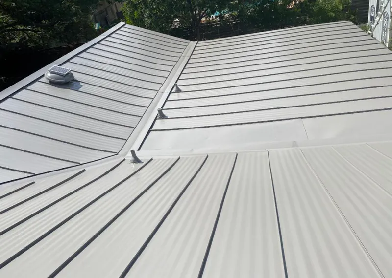 Solar attic fan installed on a metal roof for Roof Ventilation in Owings Mills
